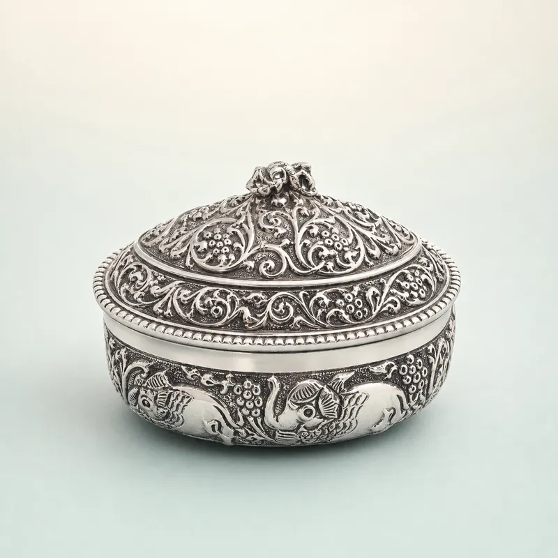 Oval Oxidised-Silver Lidded Trinket Box (fish & grapevine repoussé) - 925 Sterling Silver on seaglass background