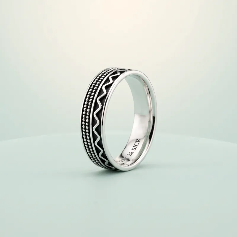 Zigzag & Granulation Bali Band (bright silver + blackened zigzag) - 925 Sterling Silver on seaglass background