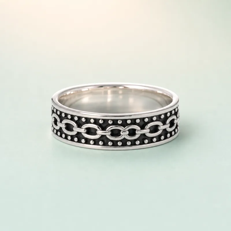 Oval Chain-Link Oxidised Band (bright rhodium silver + oxidation · no stones) - 925 Sterling Silver on seaglass background