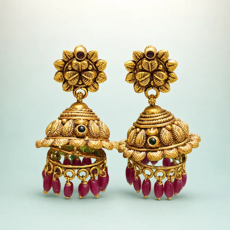 Antique gold lotus statement jhumka, green cabochons, pink/red long bead fringe - 925 Sterling Silver on seaglass background