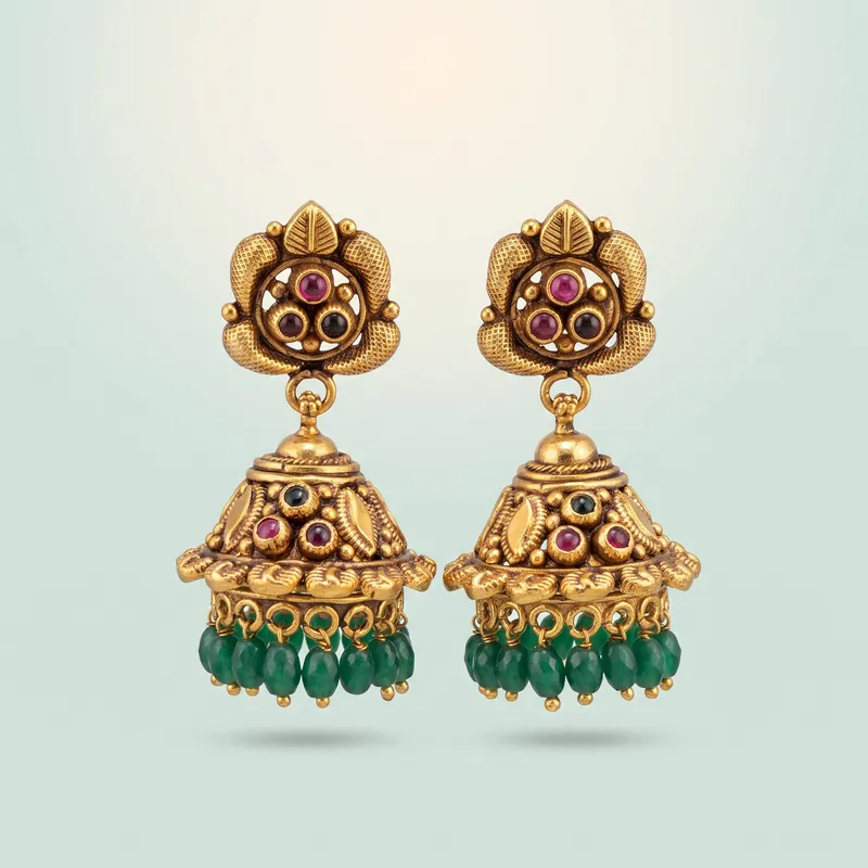 Antique gold lotus jhumka, three red cabochons, green long bead fringe - 925 Sterling Silver on seaglass background