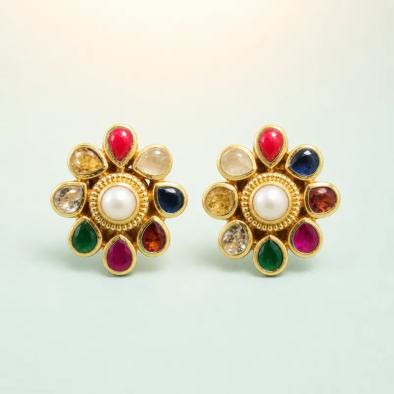 Gold navratna floral studs, nine coloured stones  -  925 Sterling Silver on seaglass background