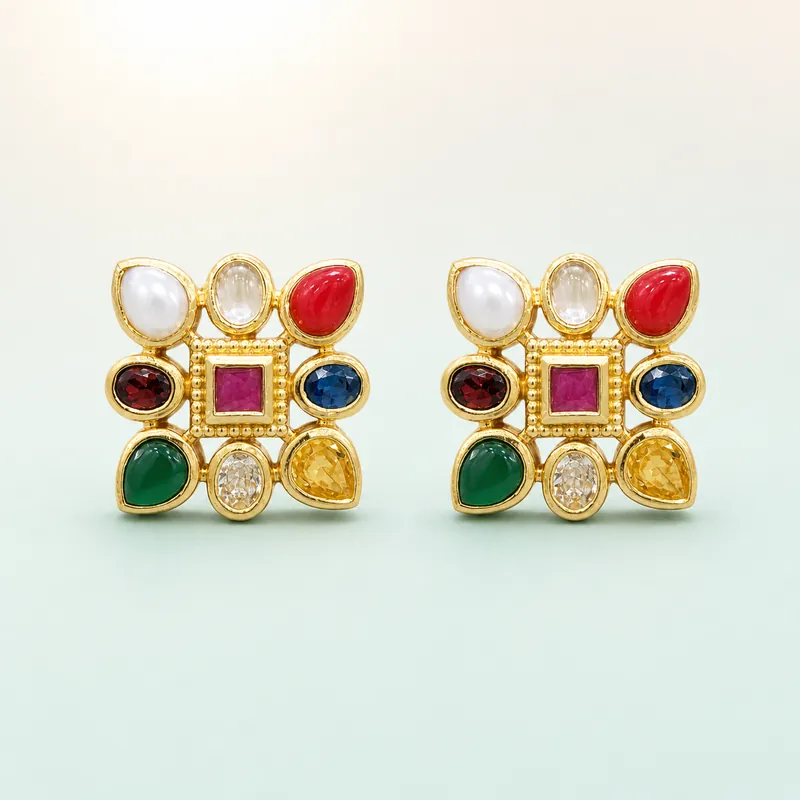 Gold navratna square studs, nine coloured stones  -  925 Sterling Silver on seaglass background