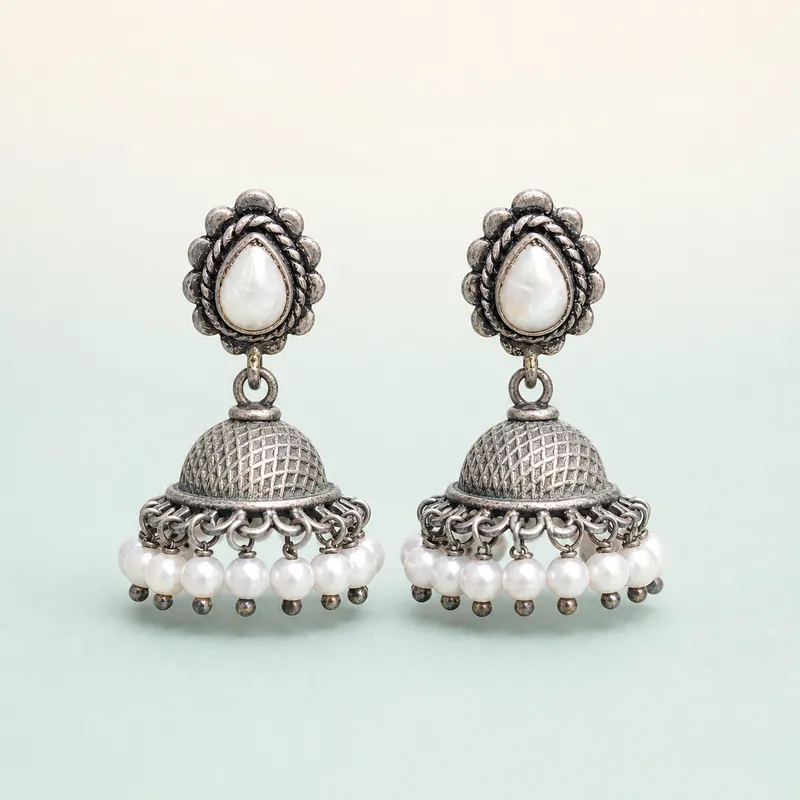 Oxidised silver floral jhumka, pearl cabochon top, white pearl fringe  -  925 Sterling Silver on seaglass background