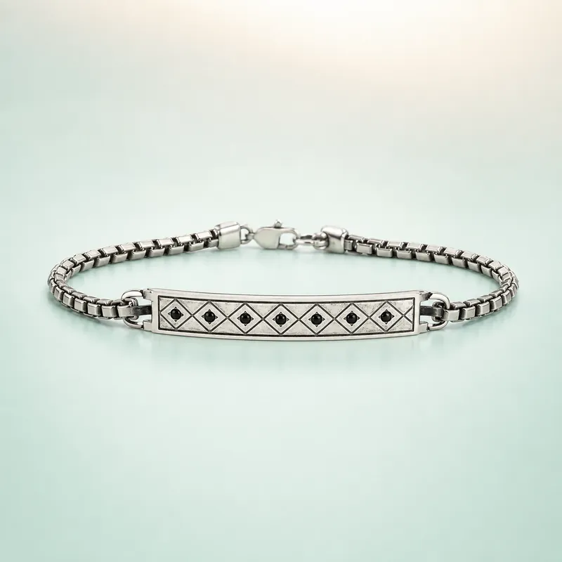 Silver box-chain ID-plate bracelet with lattice engraving & black stones - 925 Sterling Silver on seaglass background