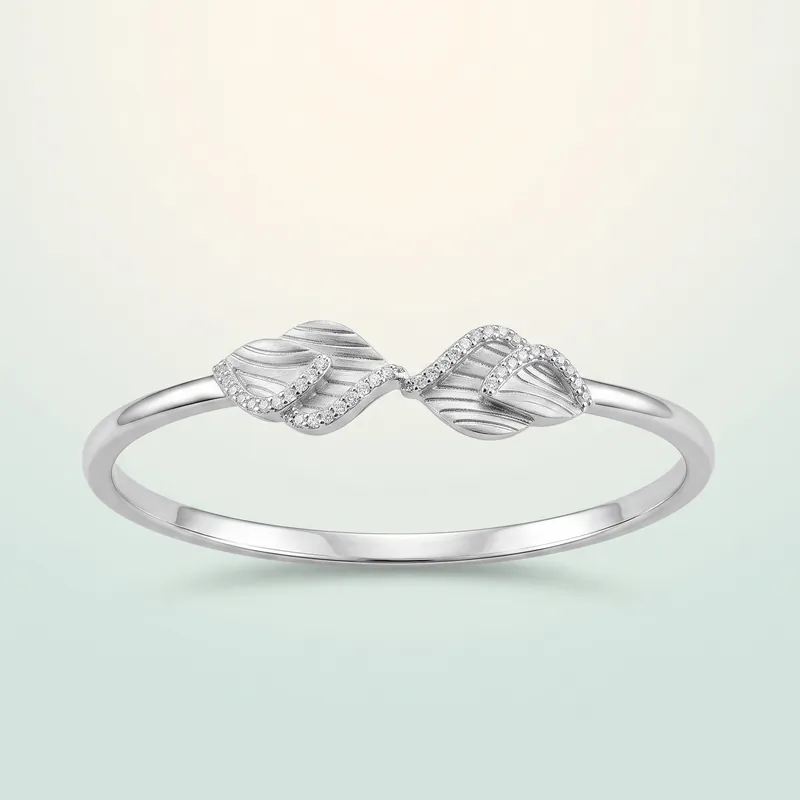 Swirled Leaf Satin-and-Pavé Silver Bangle (bright silver, brushed satin + pavé) - 925 Sterling Silver on seaglass background