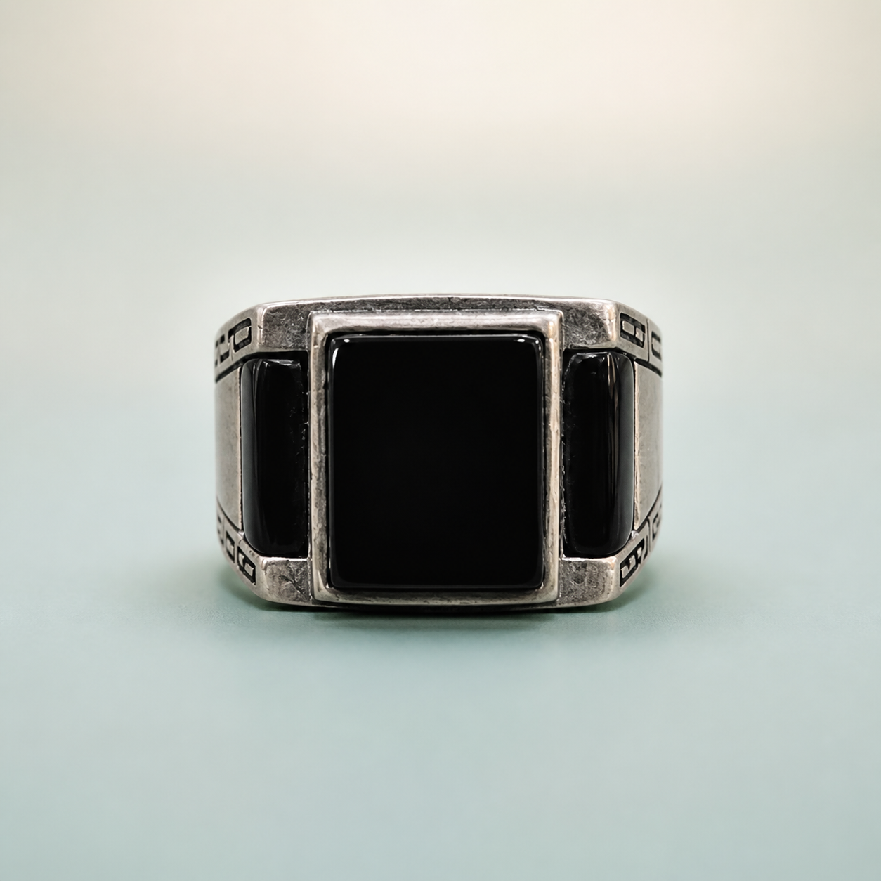 Square Black Onyx Signet Ring with Greek Key Shoulders - 925 Sterling Silver on seaglass background