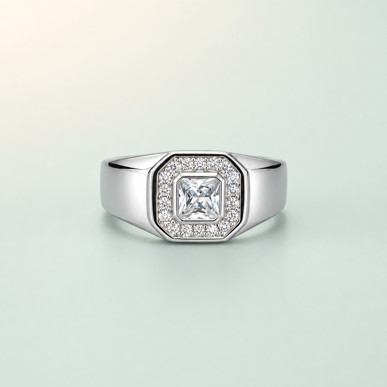 Cushion-Cut Halo Solitaire Men's Ring (bright rhodium silver · clear-white CZ) - 925 Sterling Silver on seaglass background