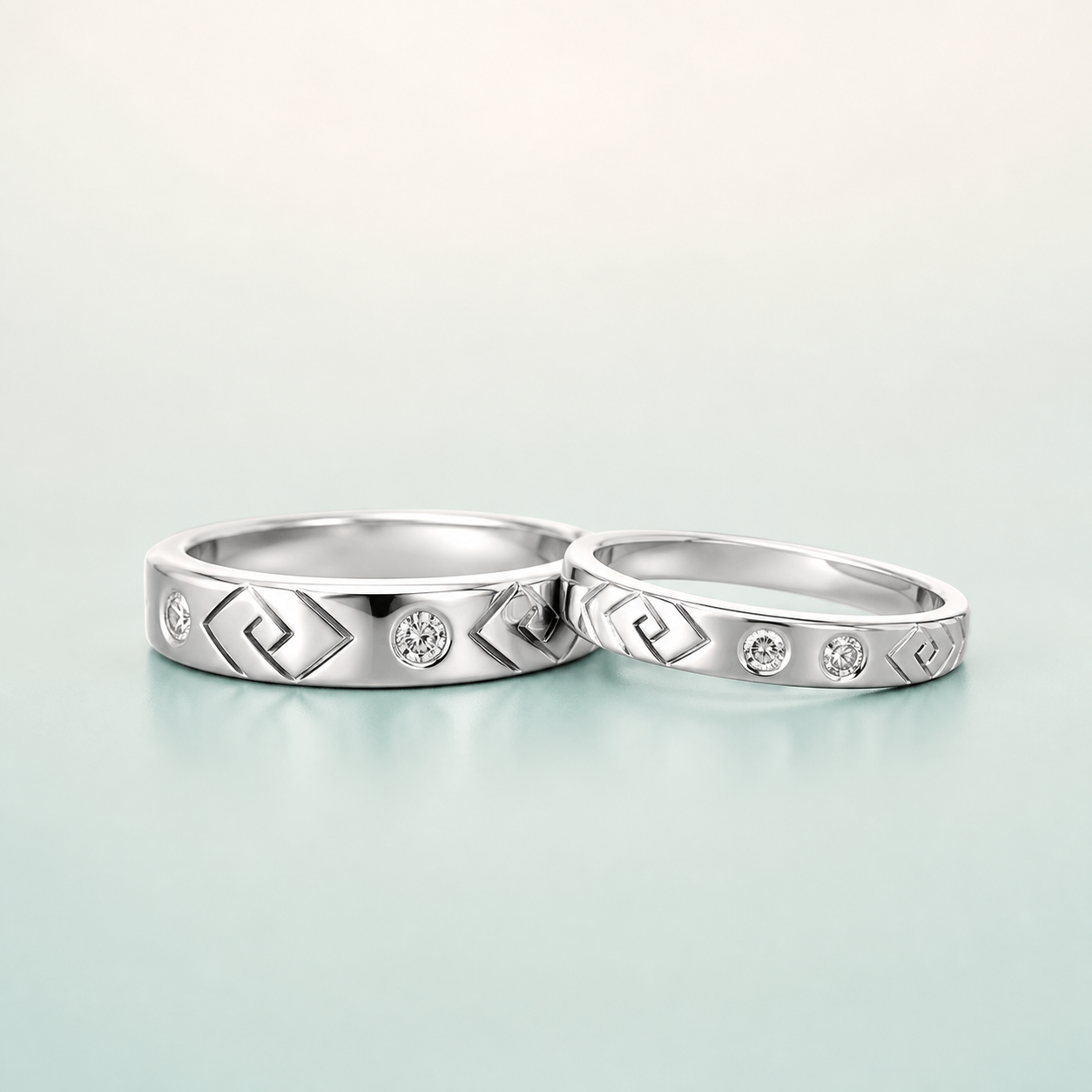Geometric Greek-Key CZ Couple Ring Set (bright rhodium silver · clear-white CZ) - 925 Sterling Silver on seaglass background