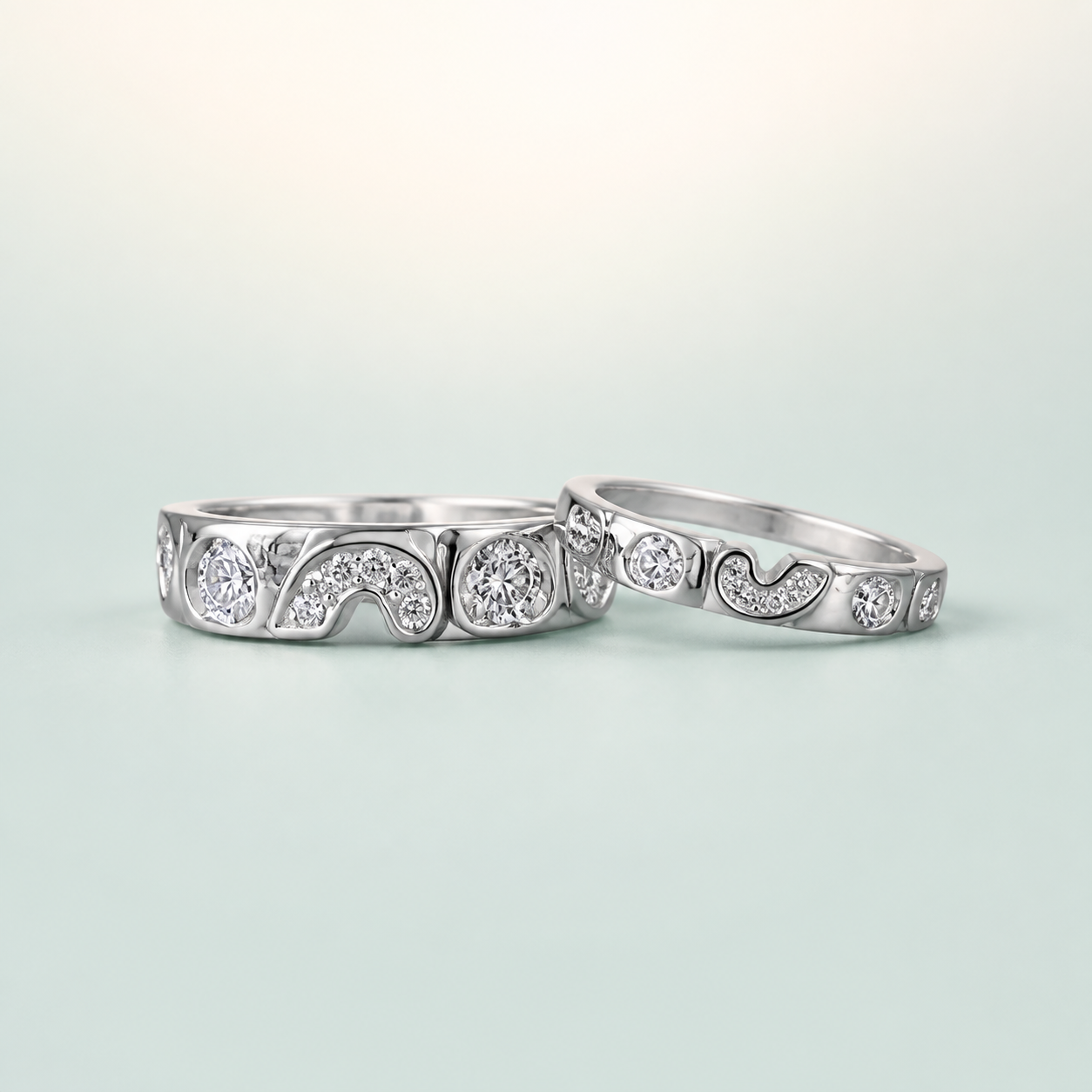 S-Scroll Paisley Bezel-CZ Couple Ring Set (bright rhodium silver · clear-white CZ) - 925 Sterling Silver on seaglass background