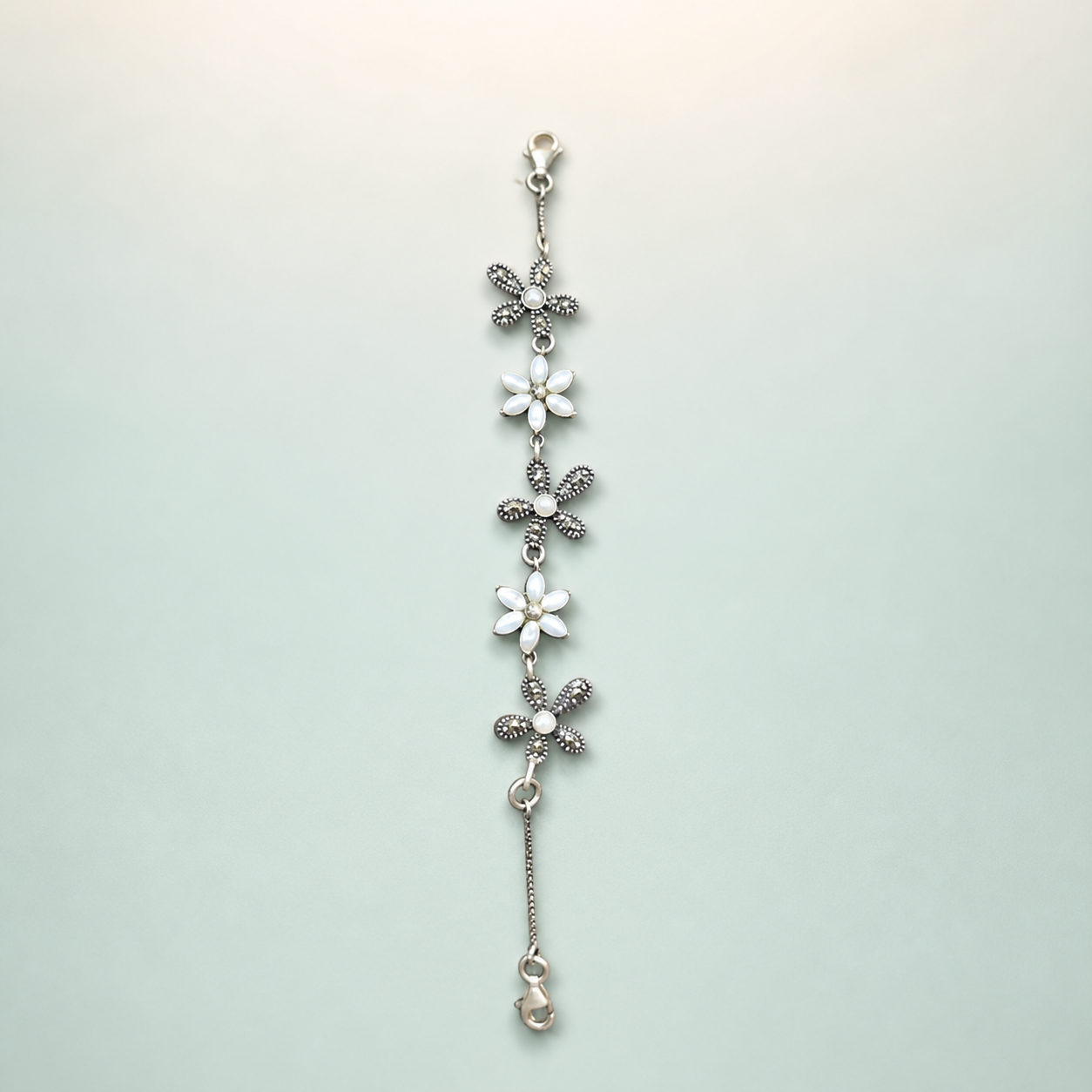 Marquise Pavé-CZ Chain Bracelet (bright polished silver · clear CZ) - 925 Sterling Silver on seaglass background