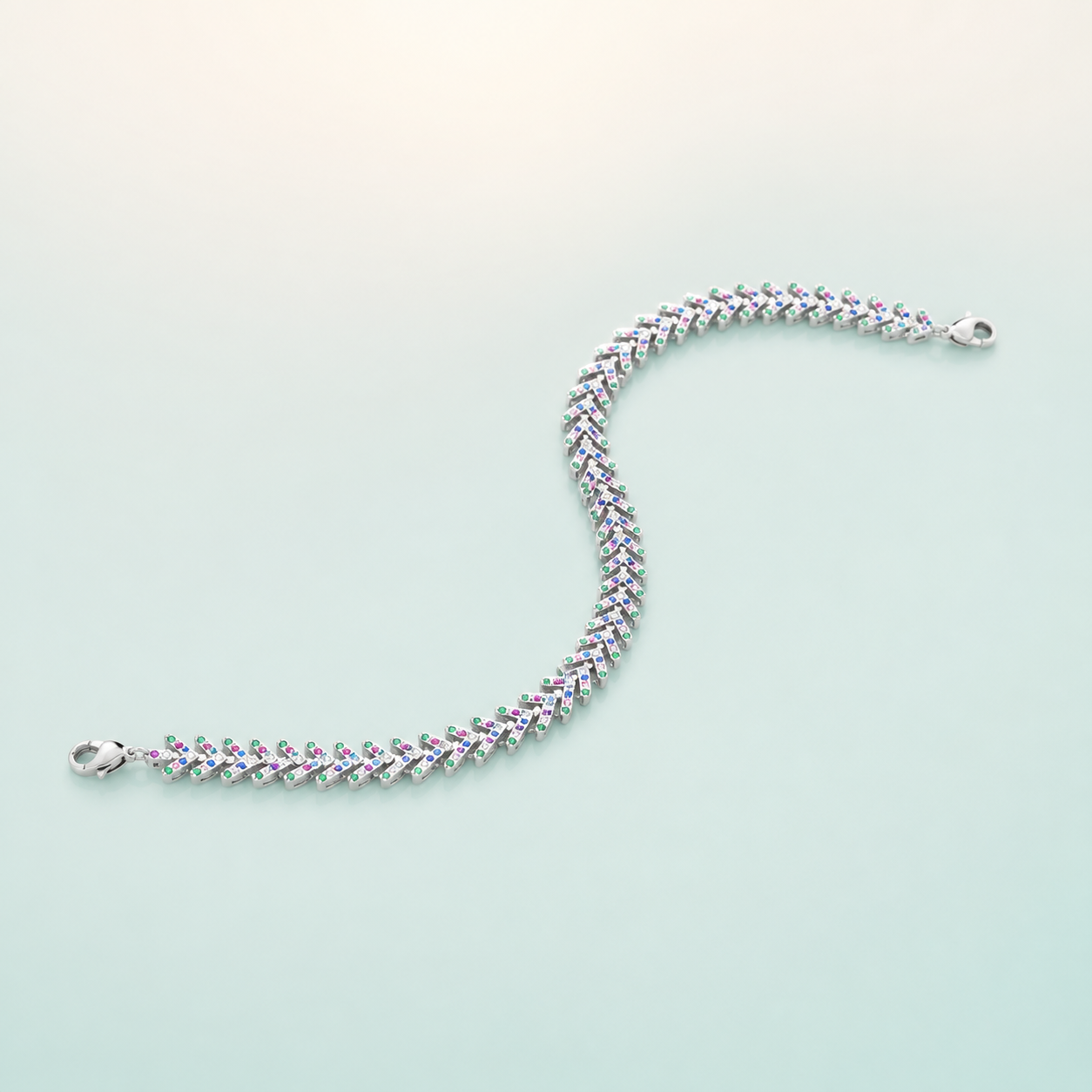 Multicolour Chevron-CZ Tennis Bracelet (bright polished silver · multicolour CZ) - 925 Sterling Silver on seaglass background