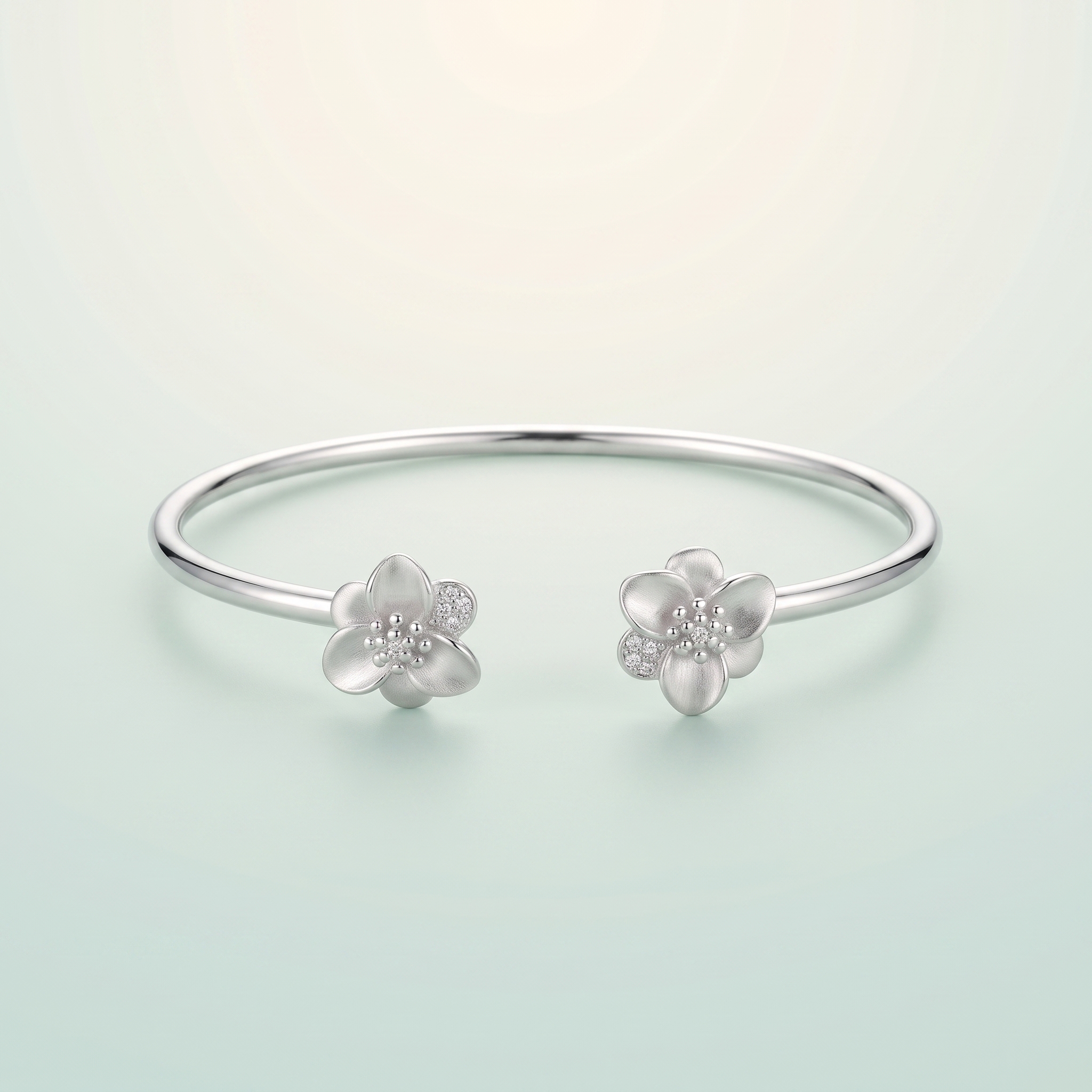 Plumeria Satin-Flower Open Cuff Kada (bright silver · satin-finish flower) - 925 Sterling Silver on seaglass background