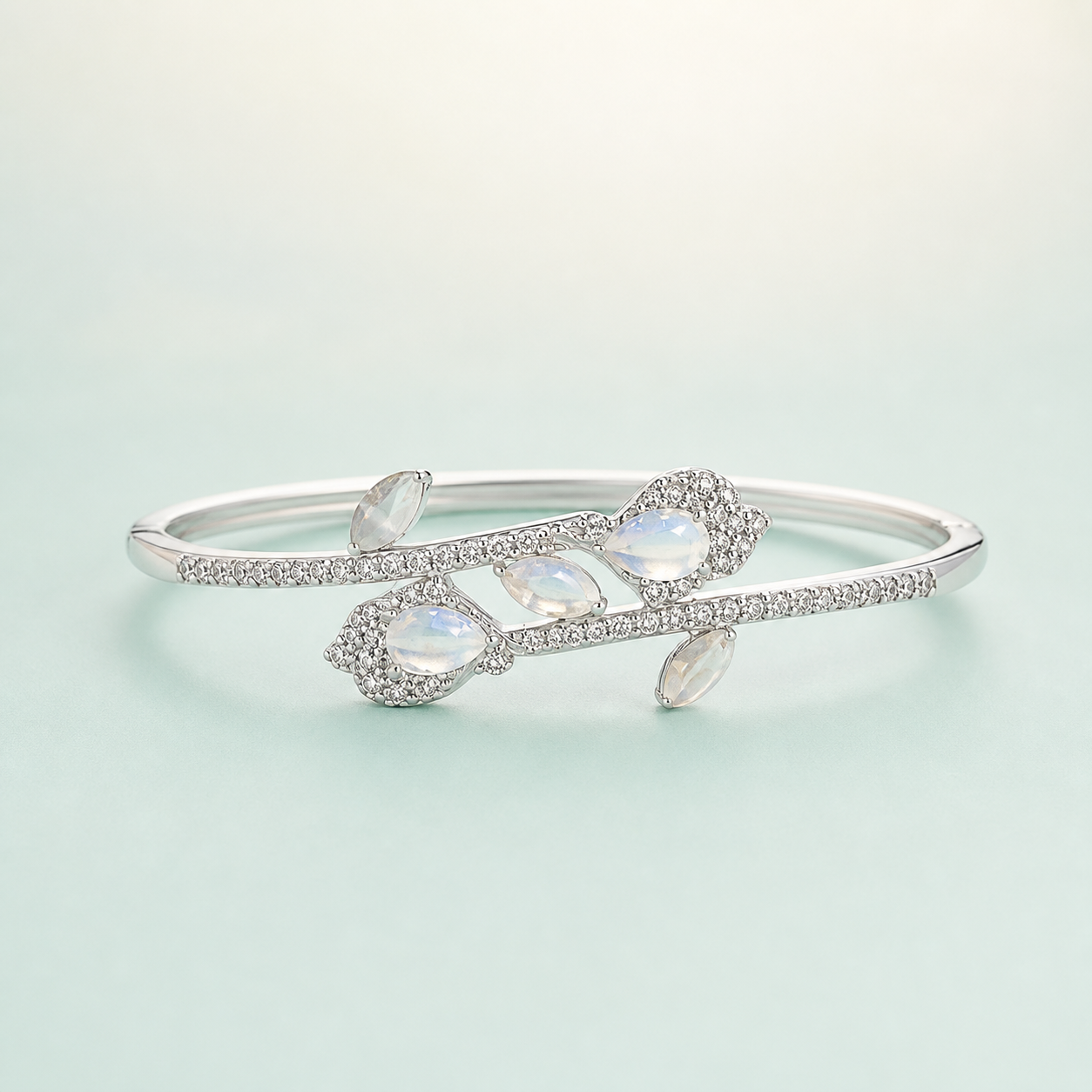 Moonstone Butterfly-Leaf Crossover CZ Open Cuff Kada (bright silver + moonstones + CZ) - 925 Sterling Silver on seaglass background