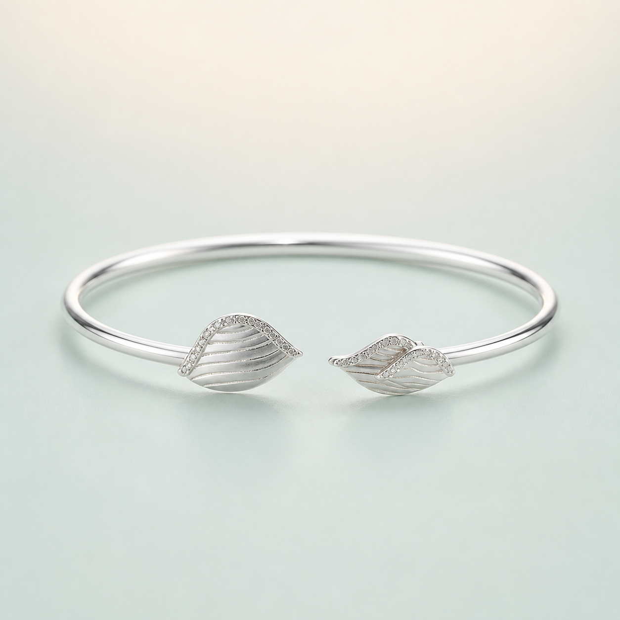 Leaf-Terminal Engraved CZ Open Cuff Kada (bright rhodium silver) - 925 Sterling Silver on seaglass background