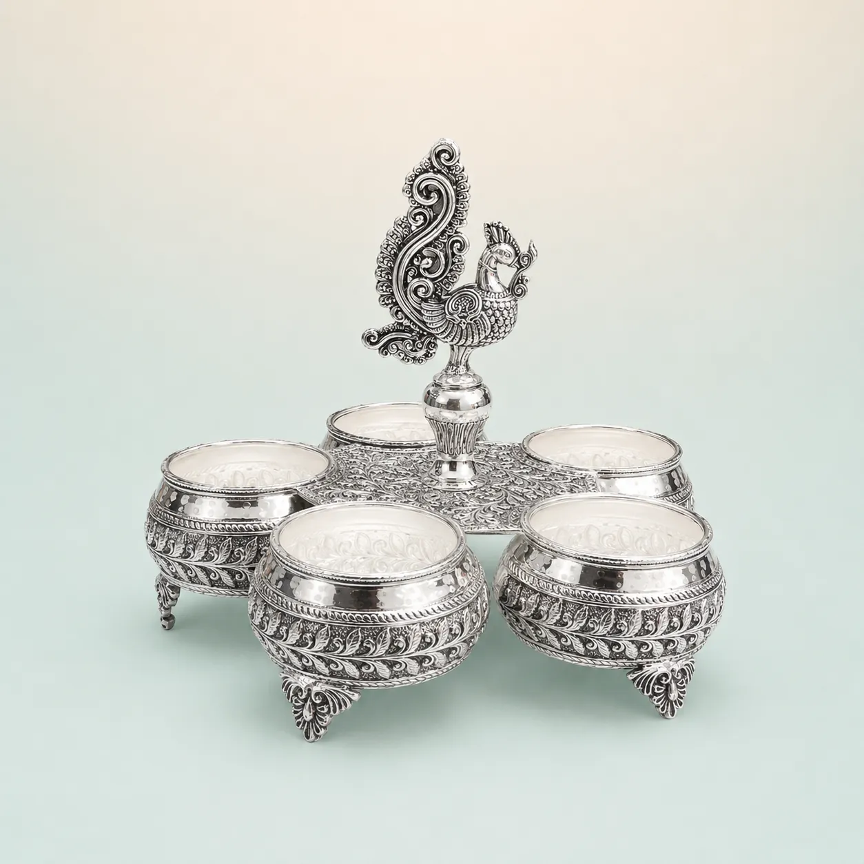 Five-Bowl Peacock Serveware Set on seaglass background