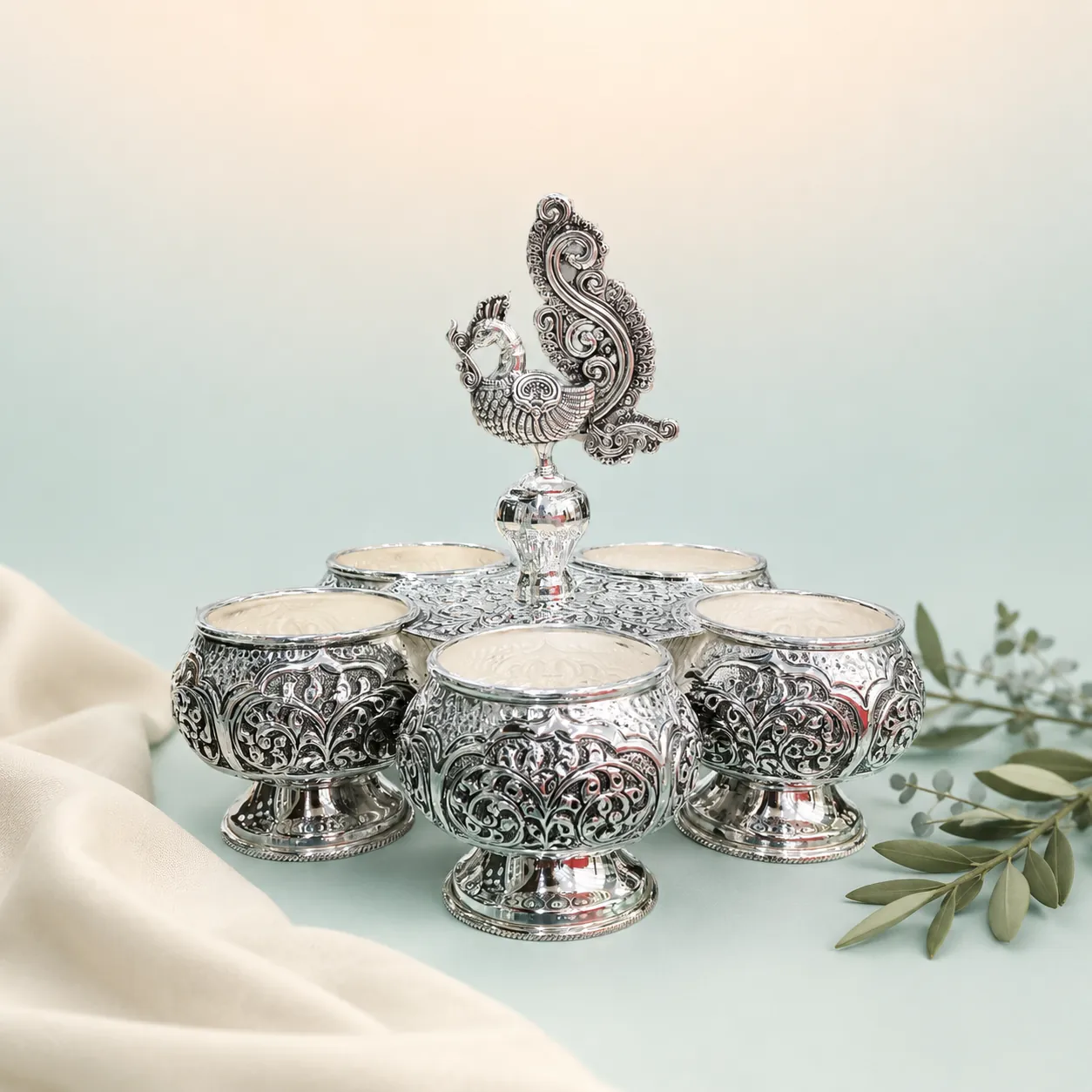 Five-Bowl Peacock Serveware Set on seaglass background