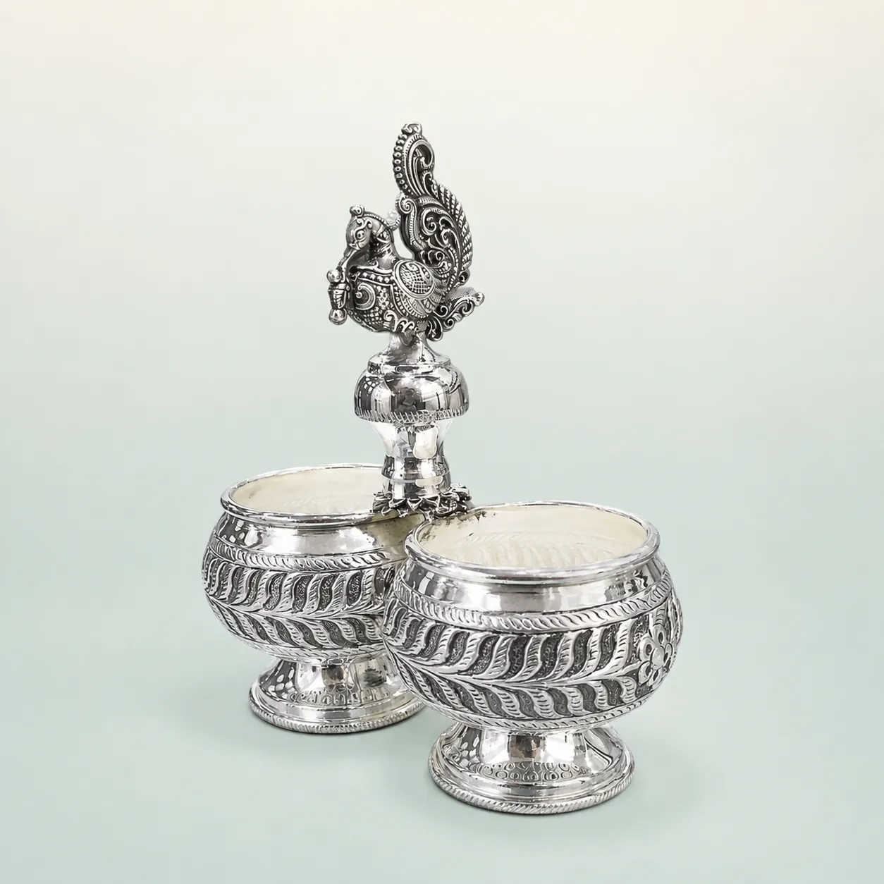 Twin-Bowl Peacock Condiment Server on seaglass background