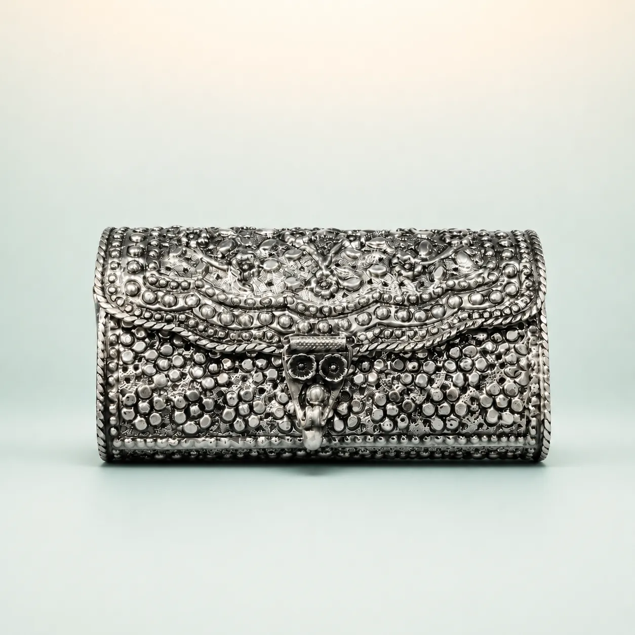 Fern-Vine Repoussé Handle Purse — oxidised trapezoid handbag on seaglass background